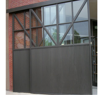 Large sliding aluminum doors with matte black finish after final installation