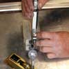 Precision testing of gauge depth, for door hardware to be mortised into bottom rail of a door